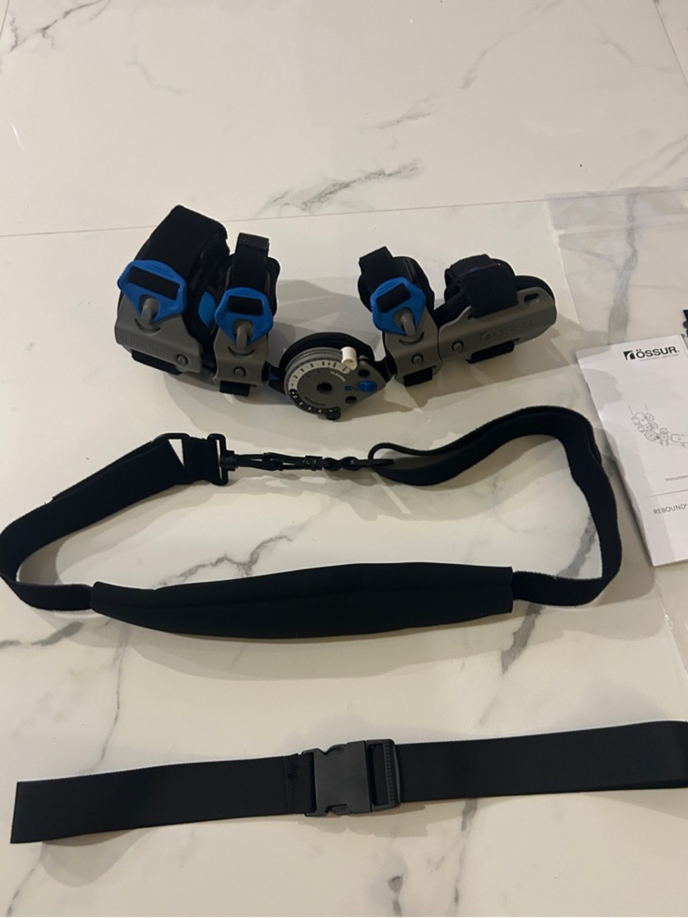 Össur Rebound Post-Op Elbow Brace Adjustable Black Gray Blue, right hand.